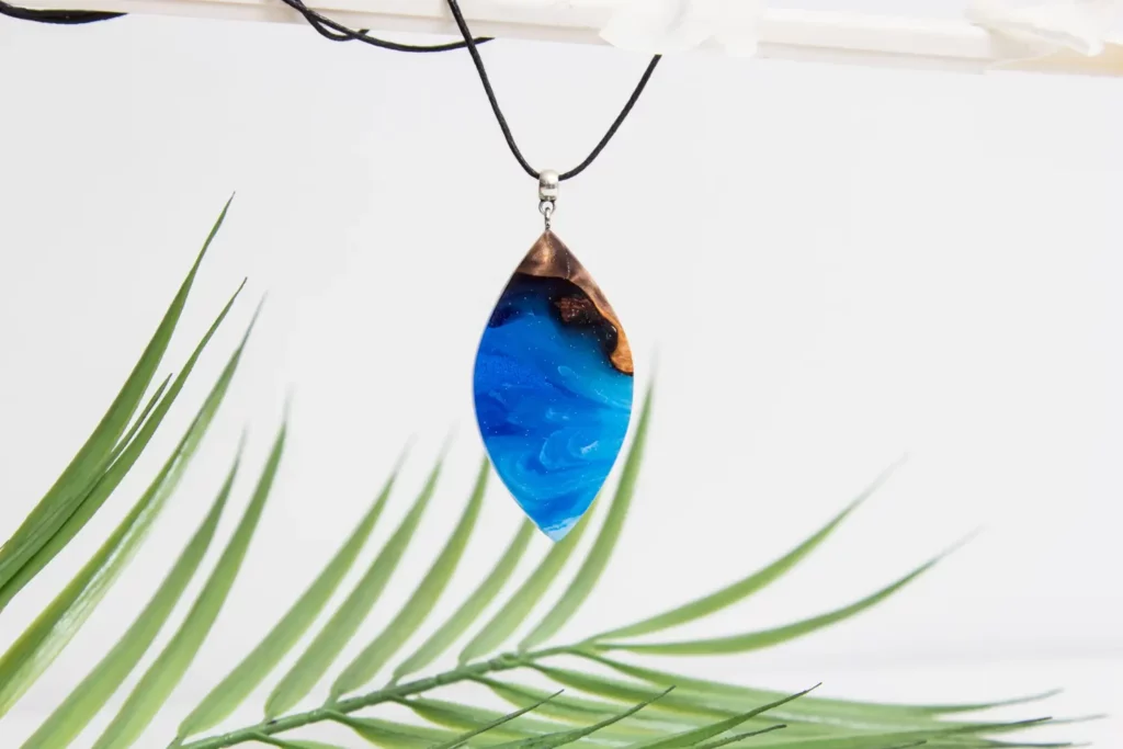 Blue resin and wood pendant necklace.