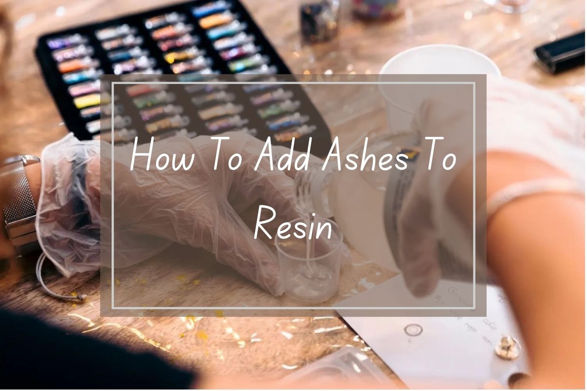 Hands in gloves adding ashes to resin.