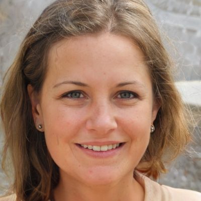 Smiling woman with light brown hair.